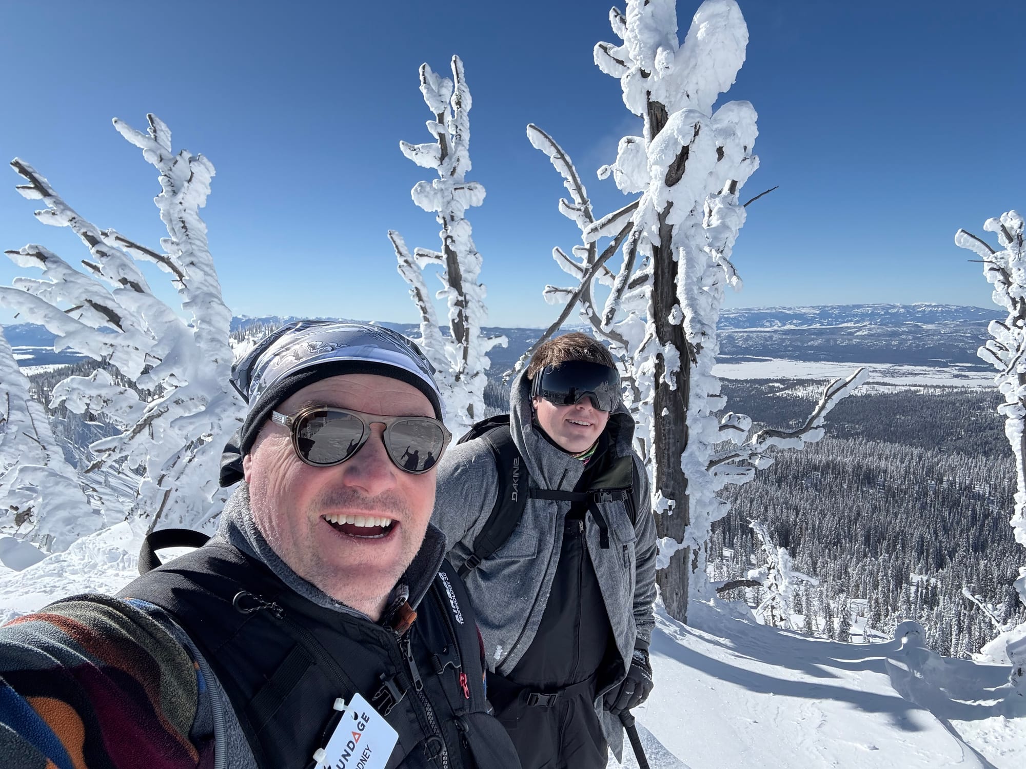 Two skiers walking the ridge to Sargents in McCall, ID.