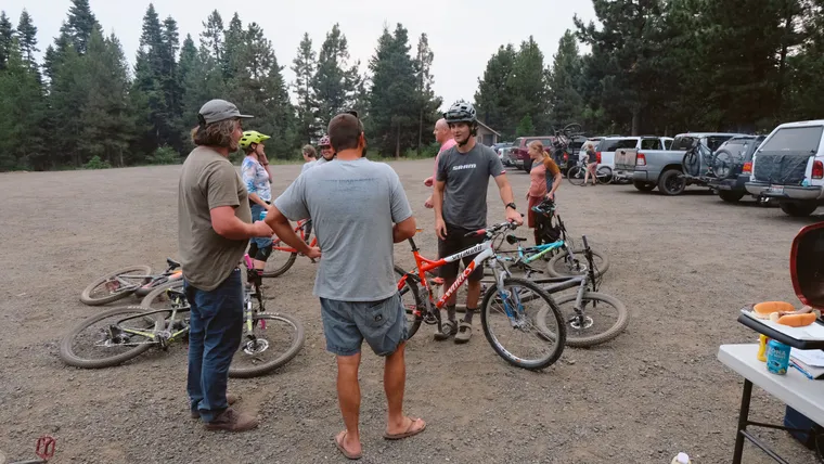 Photo of riders talking in the parking lot after the group ride at Bear Basin